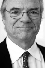 Head and shoulders photo of Michael de Pencier smiling at the camera